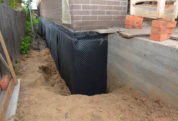 Happy homeowners after waterproofing job in Kelso